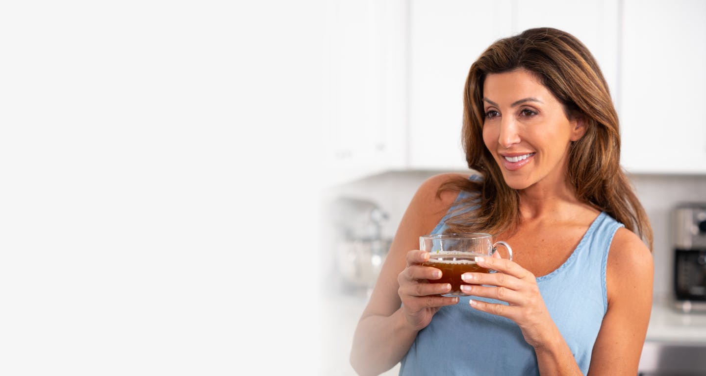 woman drinking bone broth protein chicken soup