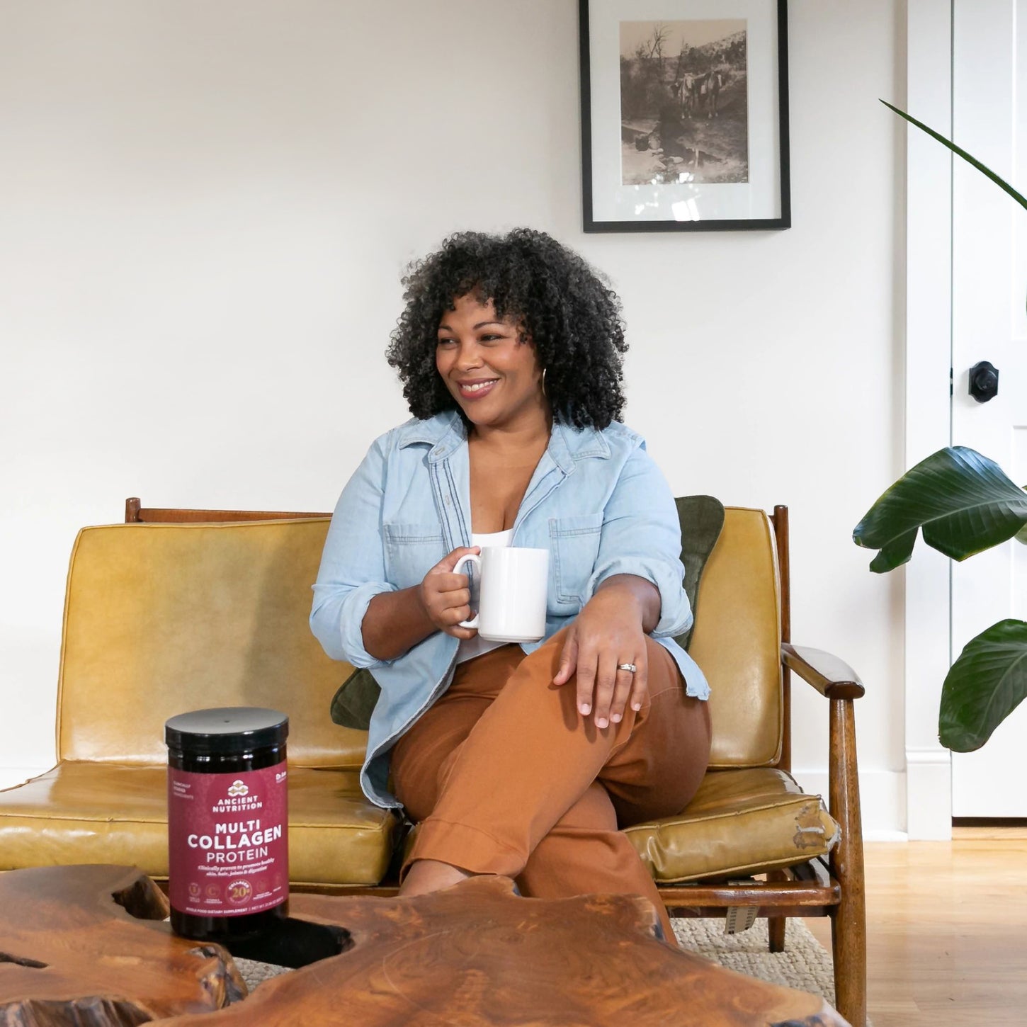 woman on chair with coffee mug