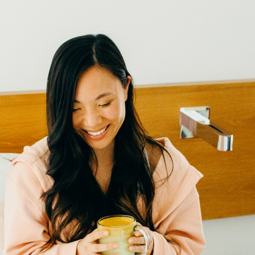 women drinking coffee in bed