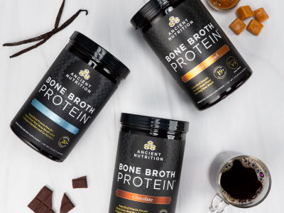 Bone Broth Protein Salted Caramel, Vanilla & Chocolate on a marble background