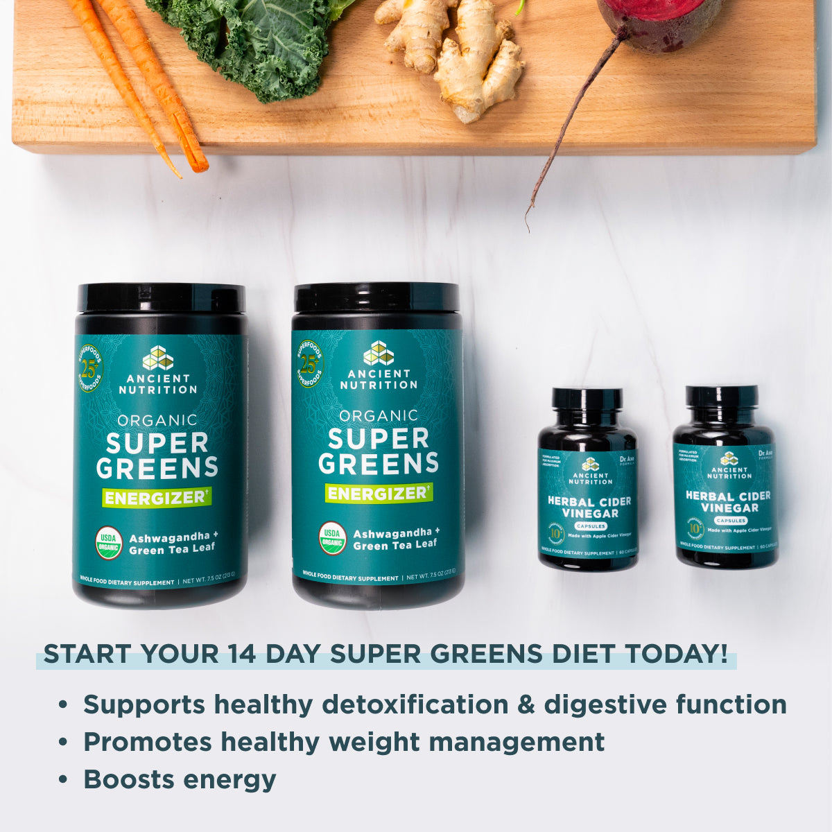 2 bottles of SuperGreens Energizer Powder + 2 bottles of Herbal Cider Vinegar Capsules next to a cutting board