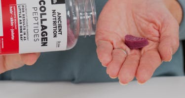 Collagen peptides gummies poured into hand